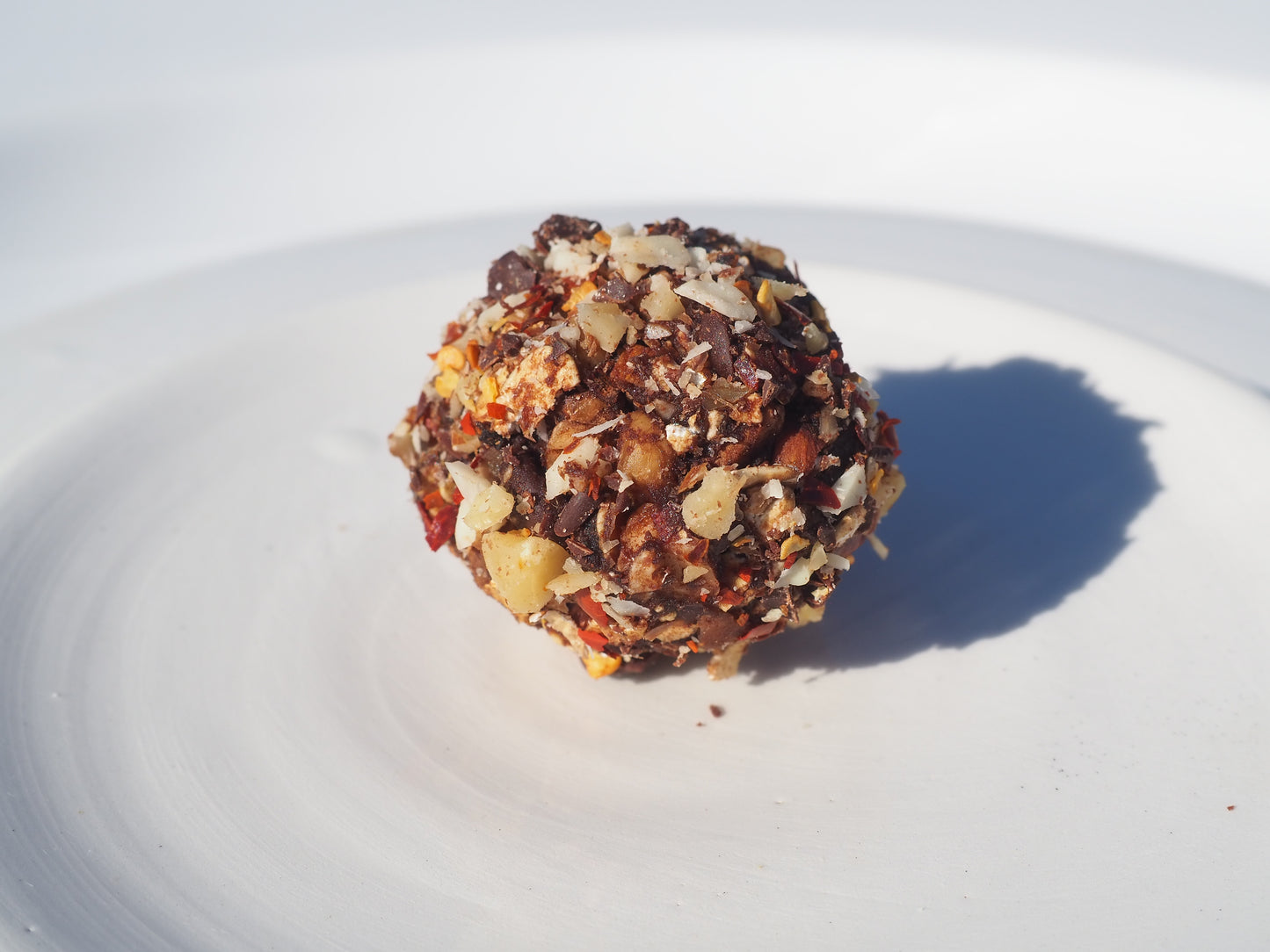 NOW – A bite with oat, walnut, almonds, cacao powder, dates, chili flakes, salt,  70% dark chocolate and Cordyceps