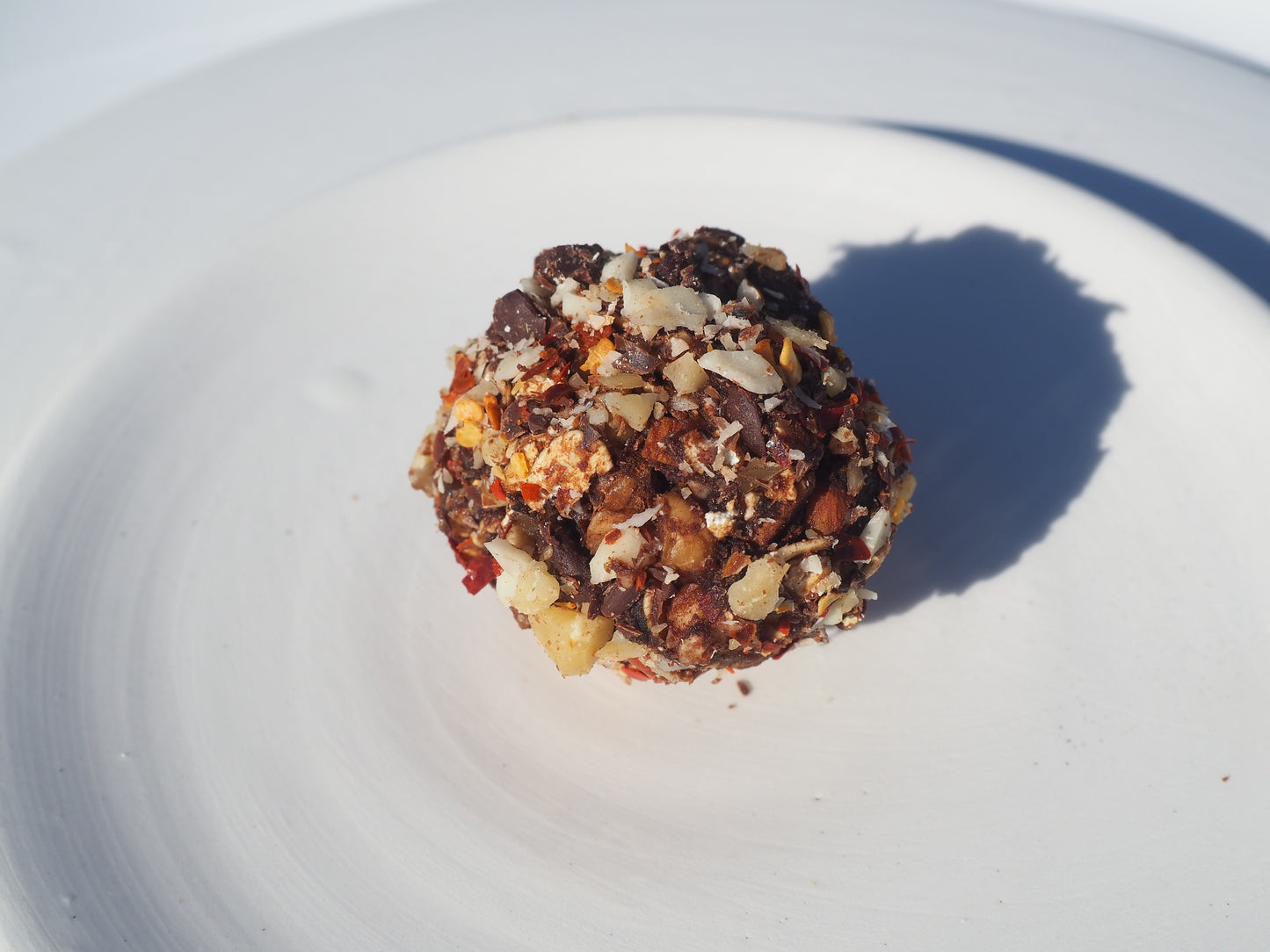 NOW – A bite with oat, walnut, almonds, cacao powder, dates, chili flakes, salt,  70% dark chocolate and Cordyceps